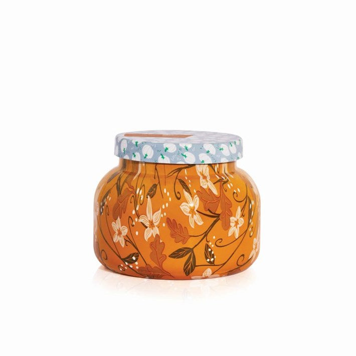Capri Blue Holiday Pattern Play Pumpkin Dulce Candle 19oz with orange pumpkin leaf pattern and light blue lid.