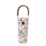 Wine bottle tote with colorful pagoda-inspired print featuring lanterns, bridges, palm trees, and willow trees with bamboo handle.