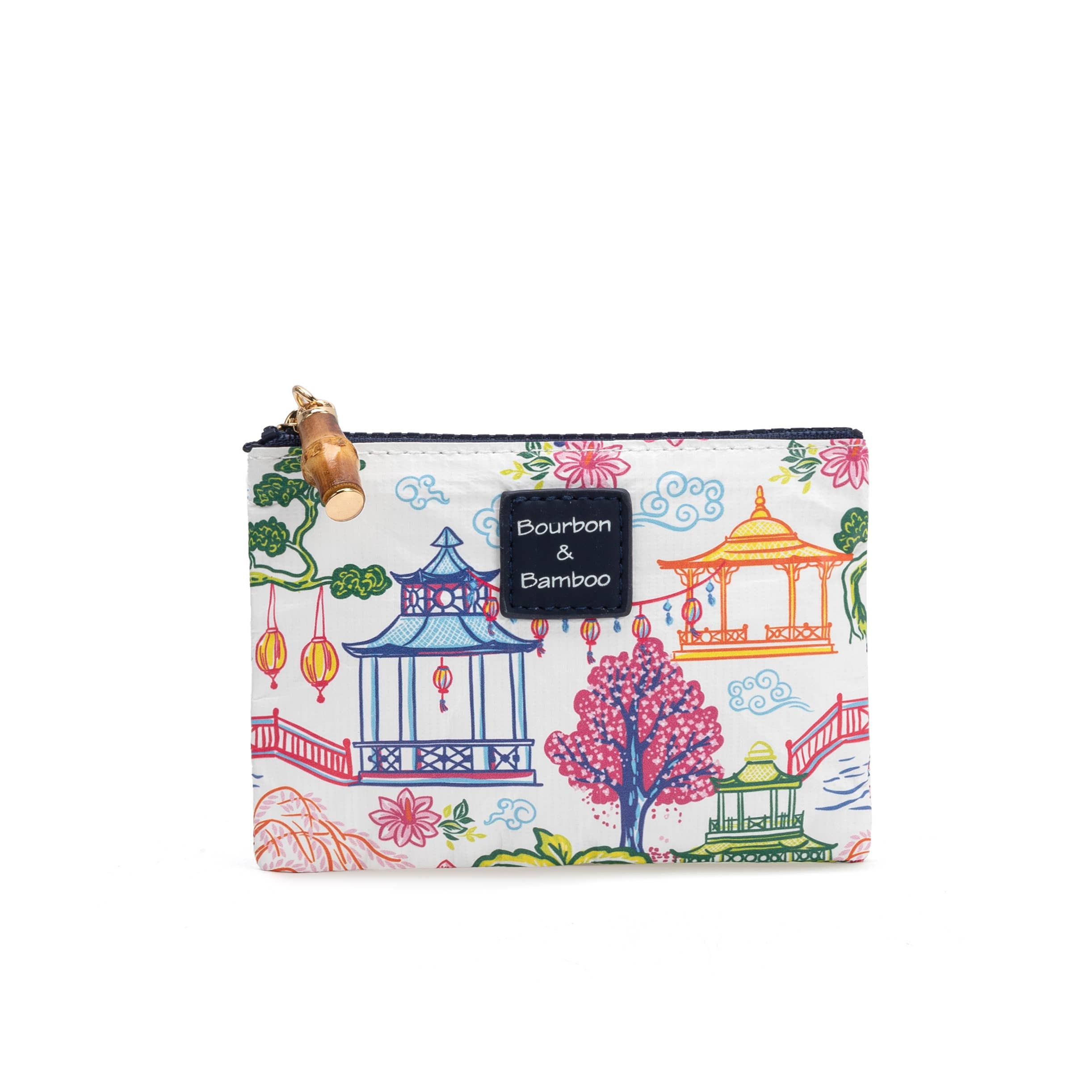 Small zip pouch with colorful pagoda-inspired print featuring lanterns, bridges, palm trees, and willow trees with bamboo zipper pull.