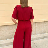 Crimson Charm Smocked Jumpsuit - The Pink Pineapple 850