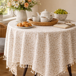 Floral cotton tablecloth with beige and taupe botanical print and ivory tassel fringe