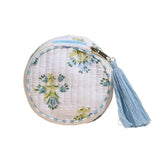 Round white quilted mini zip pouch with blue and green floral pattern and tassel zipper