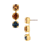 Gold-tone triple dangle earrings with champagne, amber, and dark blue round crystals.