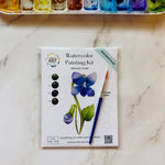 Violet February birth flower watercolor kit with floral outline, watercolor paints, paintbrush, and palette paper