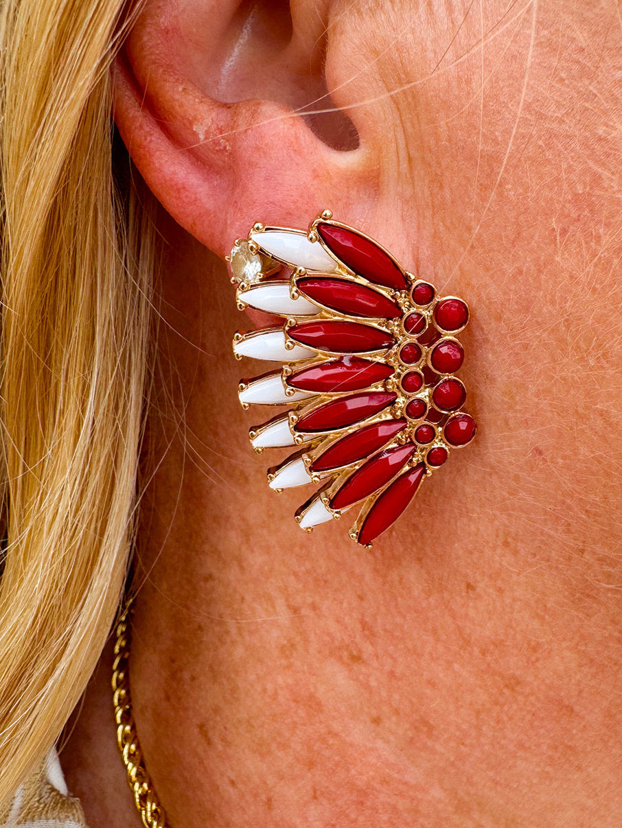 Gold-tone statement earrings with layered garnet and white enamel in a feather or starburst pattern—perfect for spirited Gameday style.
