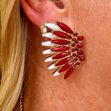 Gold-tone statement earrings with layered garnet and white enamel in a feather or starburst pattern—perfect for spirited Gameday style.
