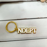Gold "NDLPT" Keychain - The Pink Pineapple 850