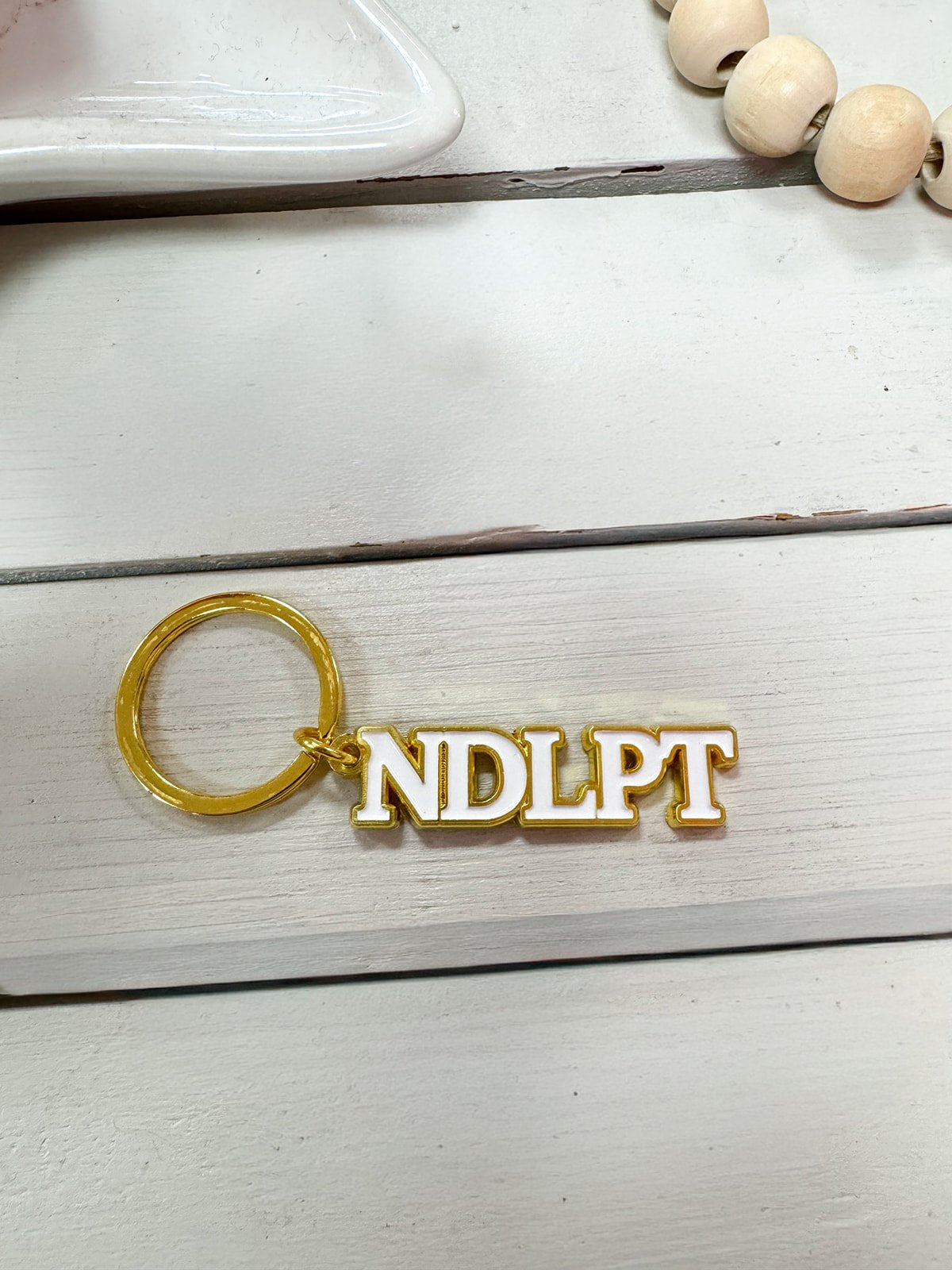 Gold "NDLPT" Keychain - The Pink Pineapple 850