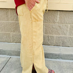 Golden wide-leg linen-blend pants with drawstring waist and square pockets—lightweight and perfect for casual gameday style
