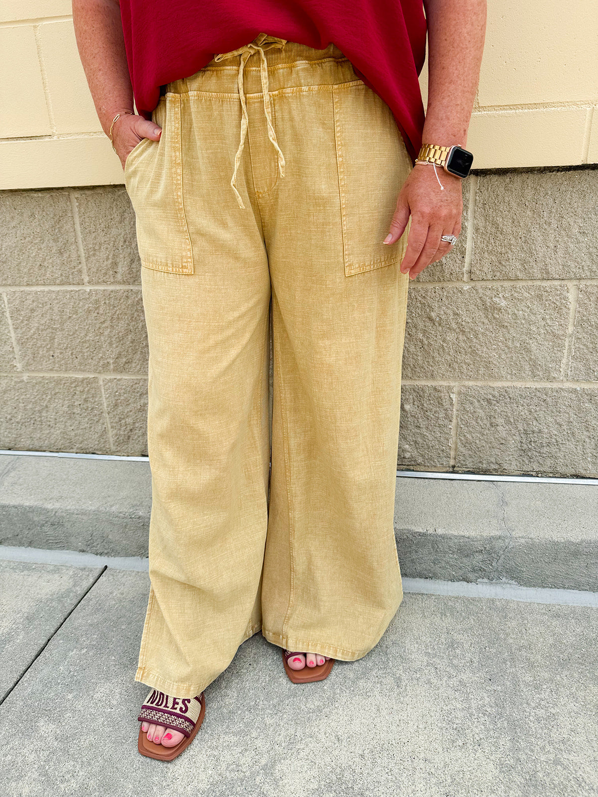 Golden wide-leg linen-blend pants with drawstring waist and square pockets—lightweight and perfect for casual gameday style