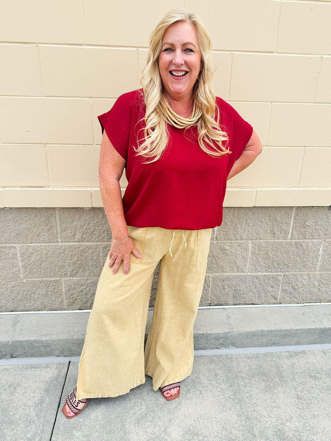 Golden wide-leg linen-blend pants with drawstring waist and square pockets—lightweight and perfect for casual gameday style