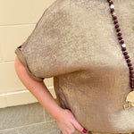 Metallic gold loungewear set with short dolman sleeve U-neck top and matching drawstring shorts