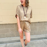 Metallic gold loungewear set with short dolman sleeve U-neck top and matching drawstring shorts