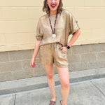 Metallic gold loungewear set with short dolman sleeve U-neck top and matching drawstring shorts