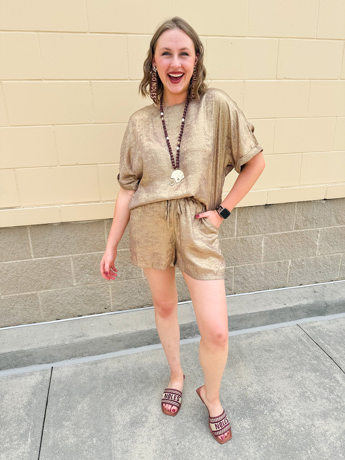 Metallic gold loungewear set with short dolman sleeve U-neck top and matching drawstring shorts