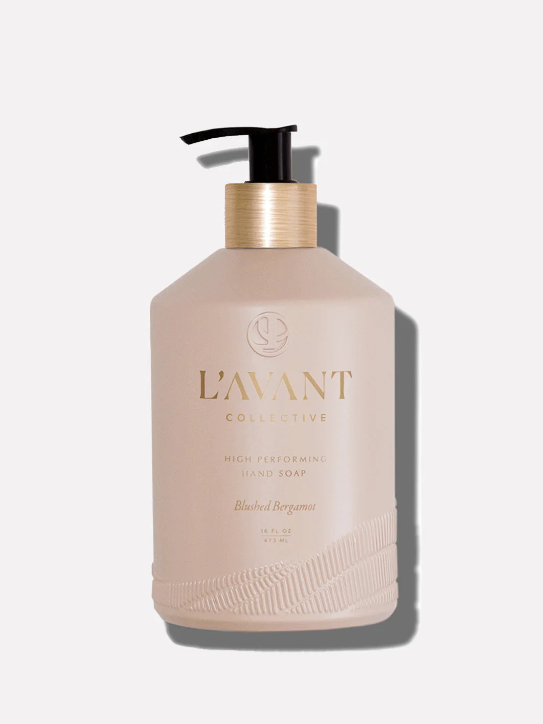 L'AVANT Blushed Bergamot Hand Soap in a refillable glass bottle with brushed gold pump and plant-based cleansing formula.