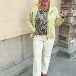 Light yellow zip-up jacket with a fold-over collar and two front button pockets.