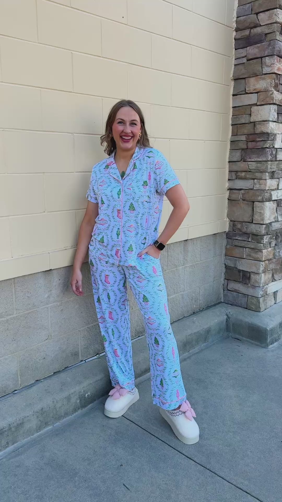 Nutcracker Charm Pajama Set with a short-sleeve collared shirt and long pants featuring nutcrackers, Christmas trees, and holiday details in white, light green, and light pink
