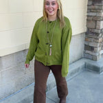 Olive Charm Cardigan in olive green with long sleeves, oval buttons, and front pockets