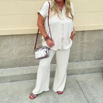 Oatmeal button-down top with gold trim, relaxed fit