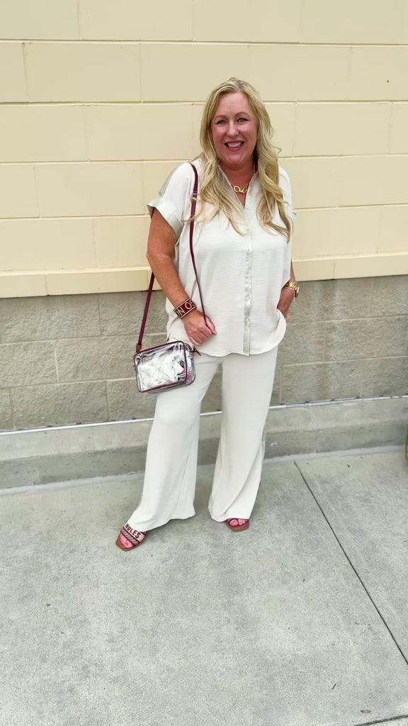 Oatmeal button-down top with gold trim, relaxed fit