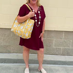 Garnet short sleeve mini dress with deep V-neck, drop shoulders, and side pockets—perfect for gameday.