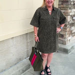 Dark olive green denim dress with a lighter green leopard print, collared V-neckline, and two front patch pockets