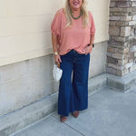 Apricot Allure Top featuring a rounded neckline, short elasticized sleeves, and a relaxed boxy fit.