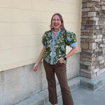 Entro Wildflower Lane Blouse with green background, blue floral print, and light blue striped and brown gingham trim along the collar and button placket
