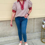Rust and cream striped pullover top with puff sleeves, contrast rust cuffs and split collar—lightweight and perfect for early fall