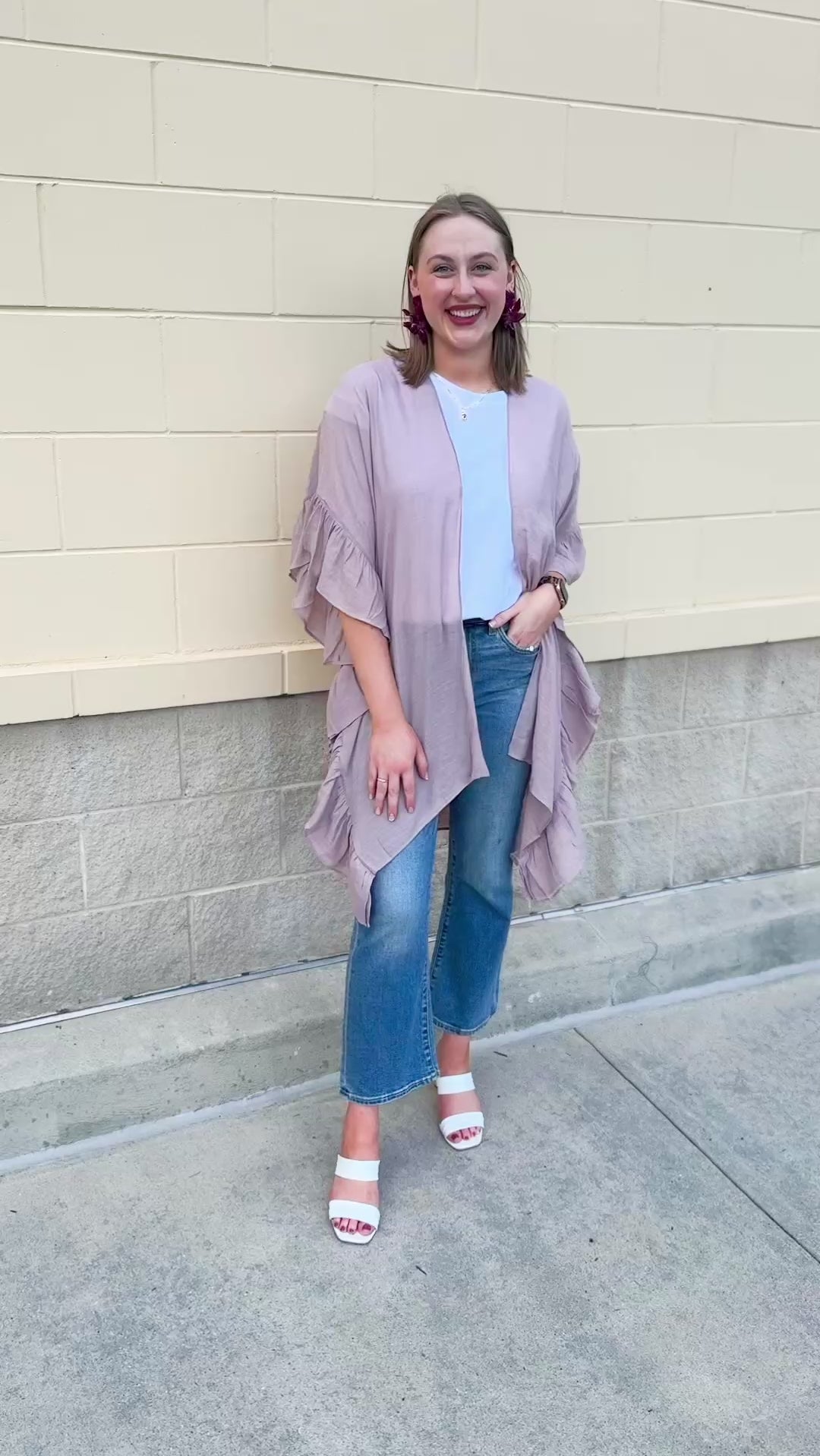 Mauve ruffle duster cardigan with open front and ruffled detailing along sides and sleeves.