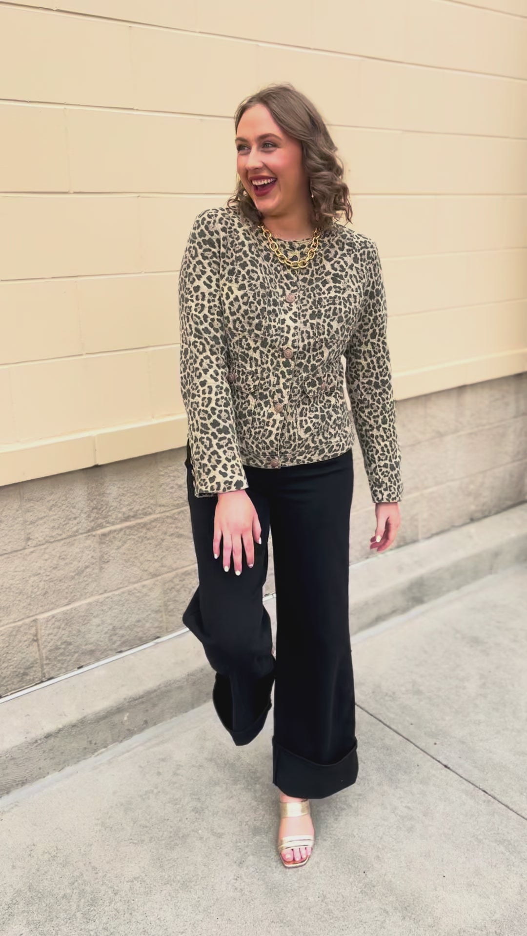 Leopard print denim jacket with gold buttons and front pockets