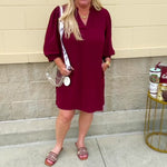 Garnet mini dress with a split U-neckline, flowy fit, and three-quarter peasant sleeves with banded cuffs. Lightweight and perfect for Gameday style.