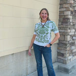 Botanical Bloom Sweater Top featuring a white background and green floral pattern.