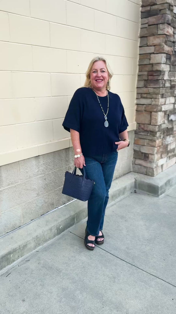 Dear John Catrina Classic Navy Top featuring a rich navy color and a versatile sweater-top design.