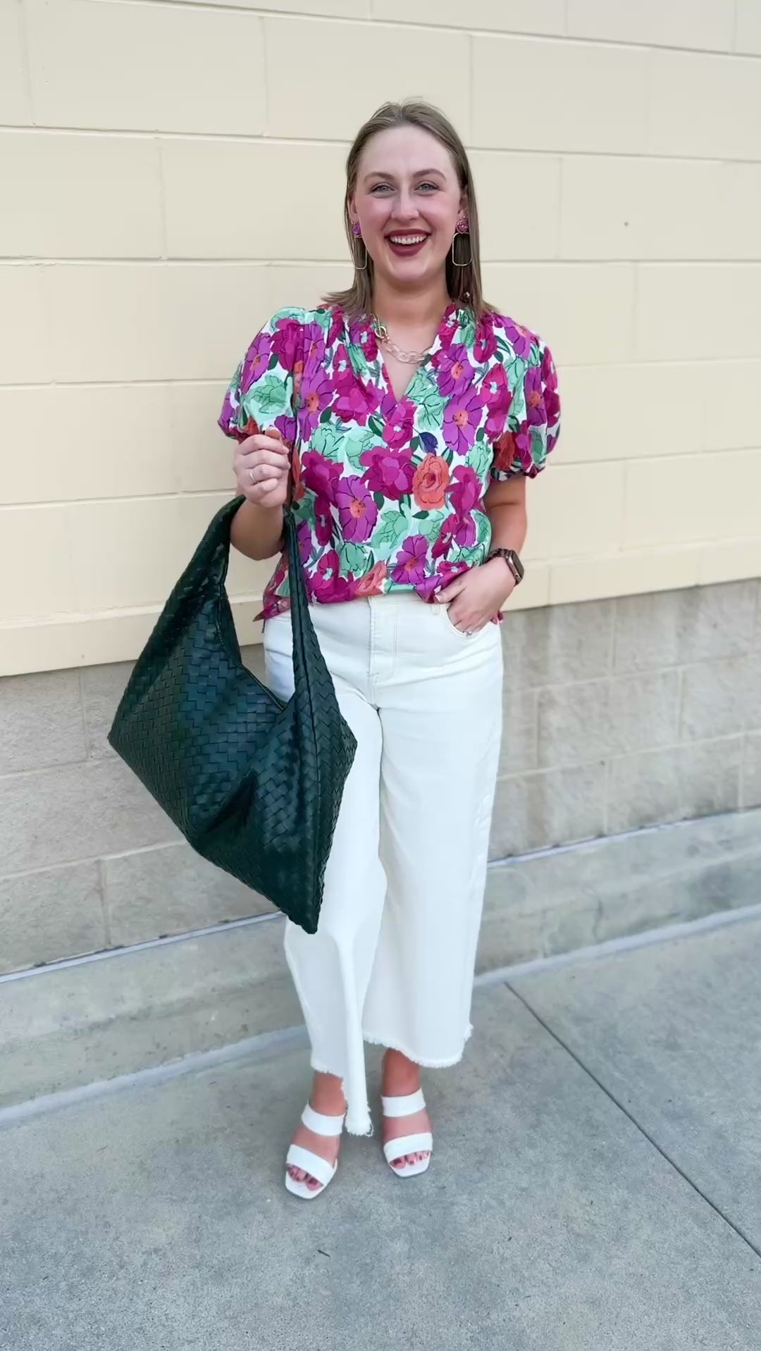 Vibrant raspberry floral blouse with ruffle-trimmed split neckline and short puff sleeves