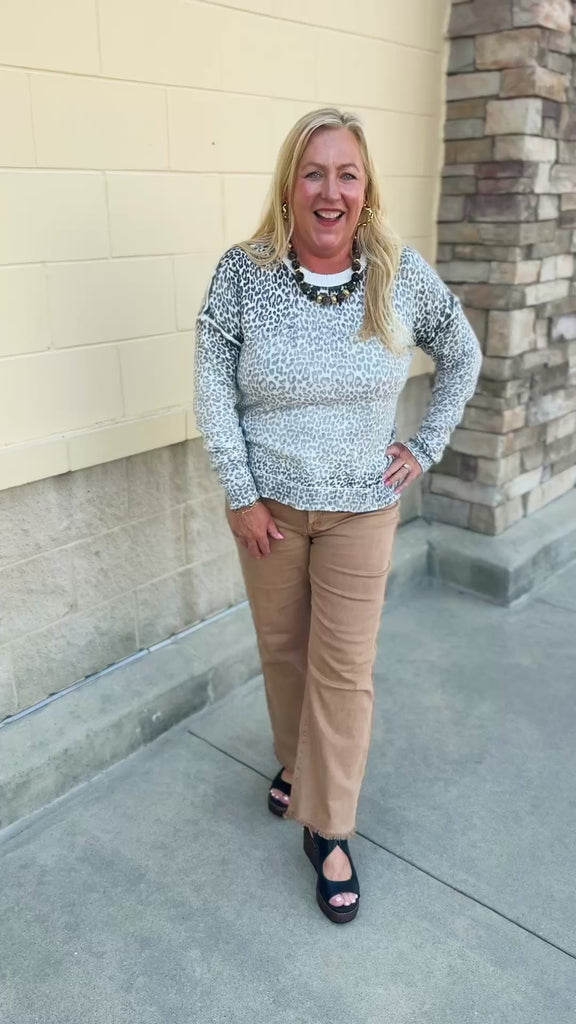 Wildly Pretty cream sweatshirt with allover cheetah print and cream neckline