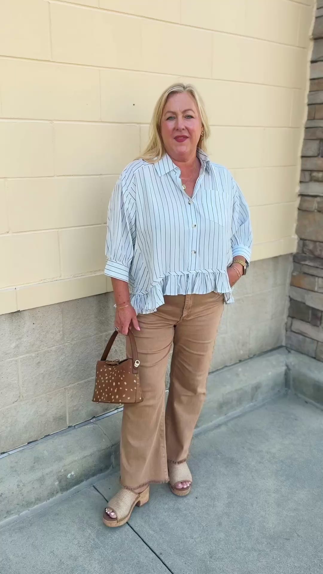 Blue Ribbon baby blue pinstripe button-down top with ruffle hem and front pocket