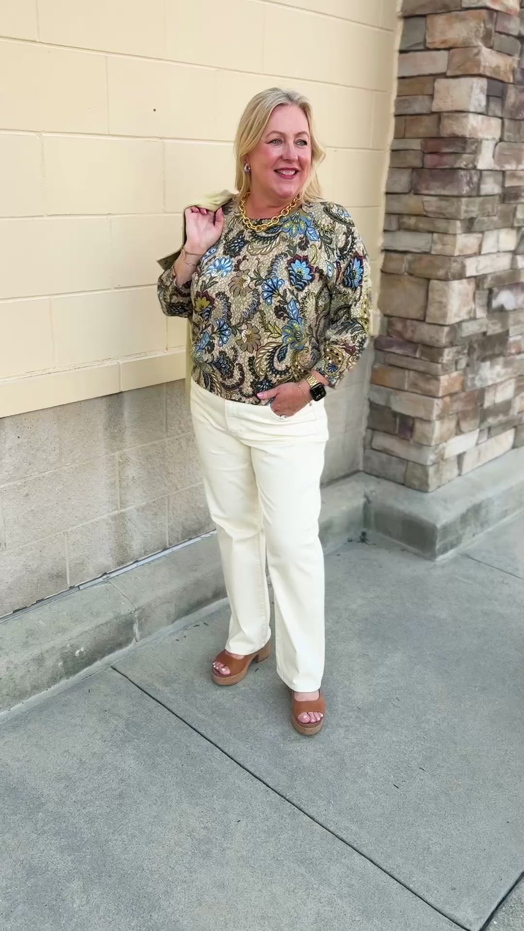 Long-sleeve top with an old-world floral print in shades of green, blue, purple, and yellow