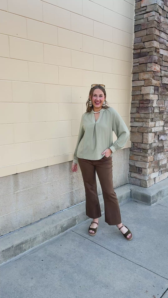 Sage Signature Blouse in sage green with long sleeves, a V-neckline
