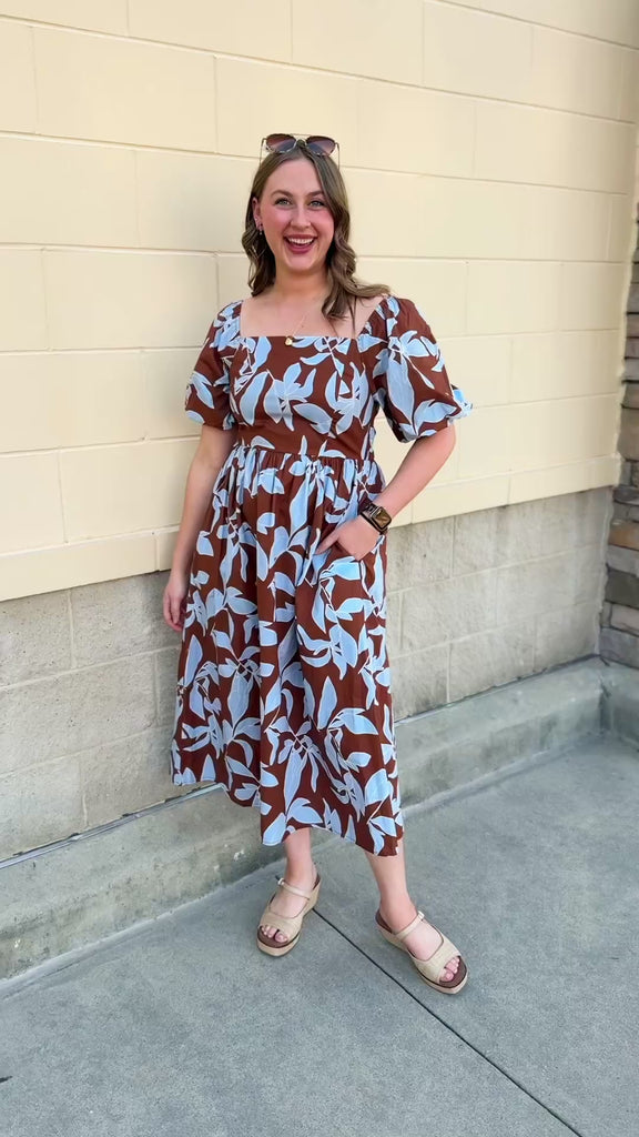 Bluebell Grove brown dress with light blue leaf pattern and short sleeves