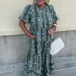 Green midi dress with white and pink floral print and short sleeves