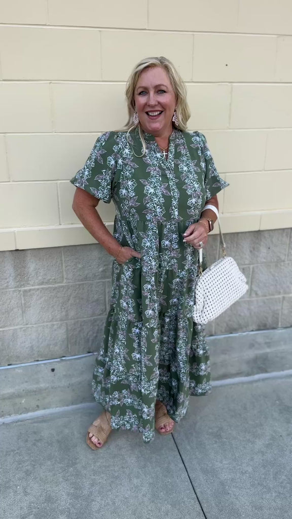 Green midi dress with white and pink floral print and short sleeves