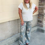 Cream short sleeve knit top with raised tonal stripe texture