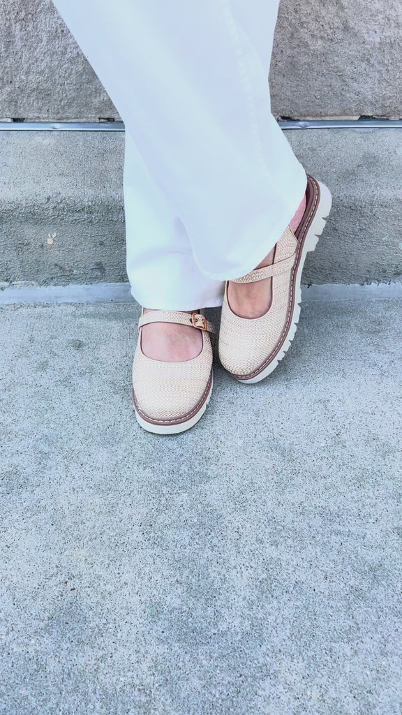 Tan woven Mary Jane flats with buckle straps and lug sole.