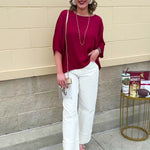 Satin dolman sleeve blouse with a round neckline, shown in a gameday-ready, lightweight and flowy style.