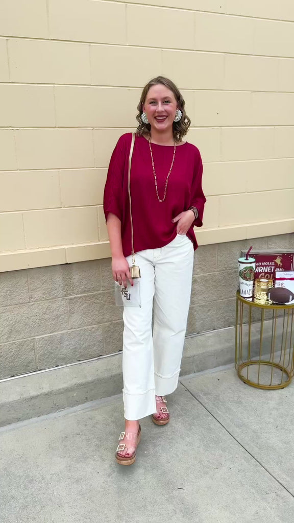 Satin dolman sleeve blouse with a round neckline, shown in a gameday-ready, lightweight and flowy style.