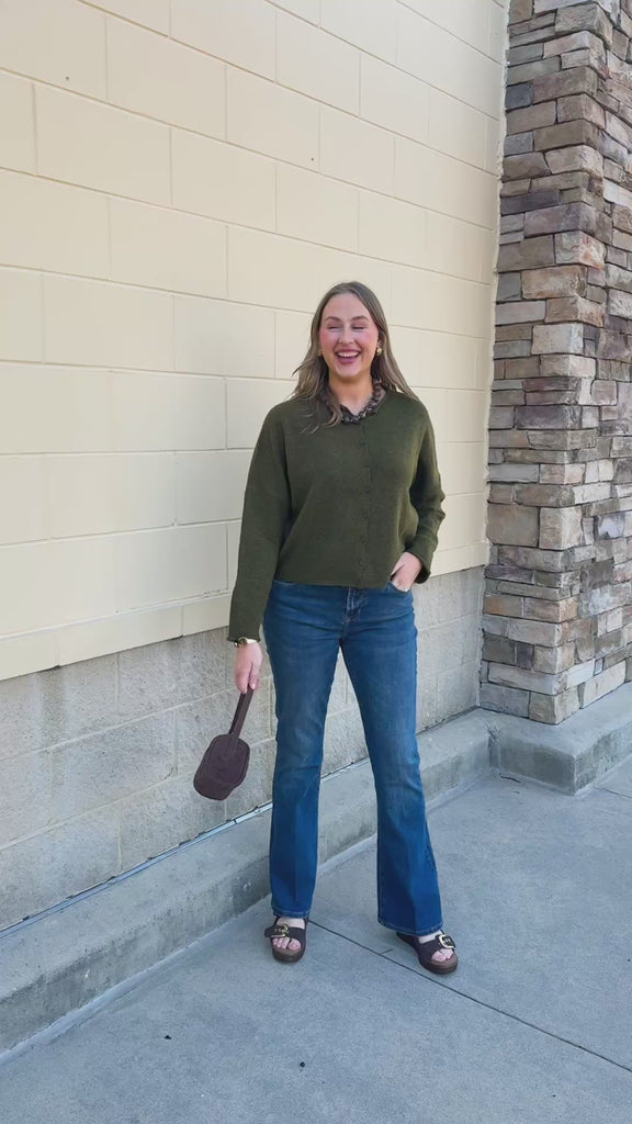  Mosswood Sweater in earthy green with small front buttons and a softly folded collar