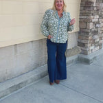 Mary Square Naomi Top in Painted Trillium Olive featuring a high split neckline and long sleeves with button cuffs