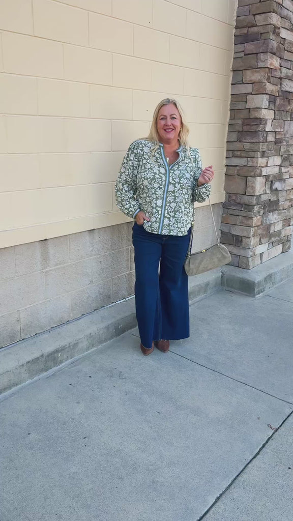  Mary Square Naomi Top in Painted Trillium Olive featuring a high split neckline and long sleeves with button cuffs
